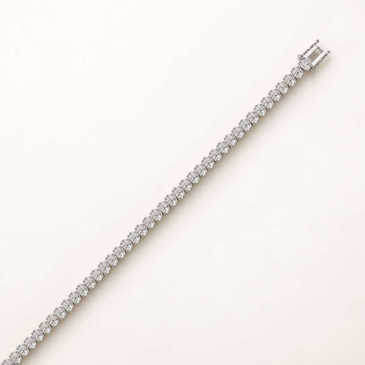 Oval-cut diamond tennis bracelet in white gold, open clasp detail
