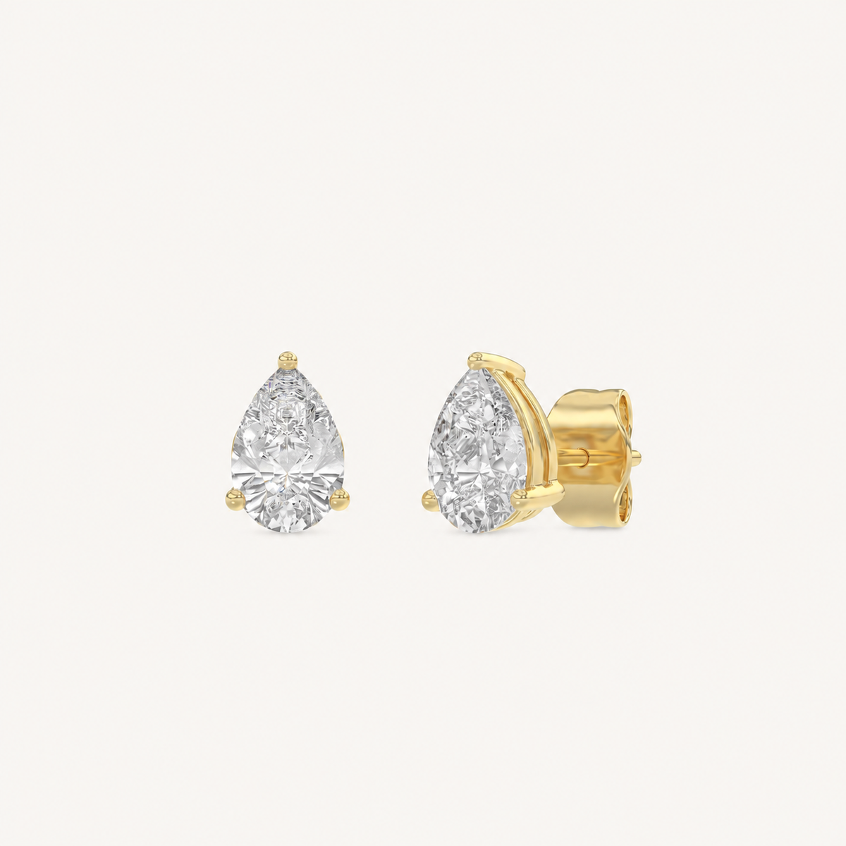 Pear-cut 3-prong basket lab-grown diamond stud earrings in yellow gold, 1 ct total weight