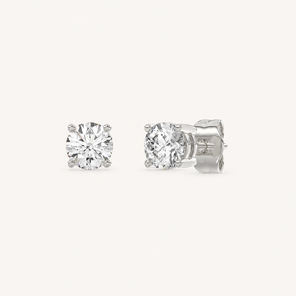 White gold round-cut four-prong basket lab-grown diamond stud earrings, 1.5 ct total weight