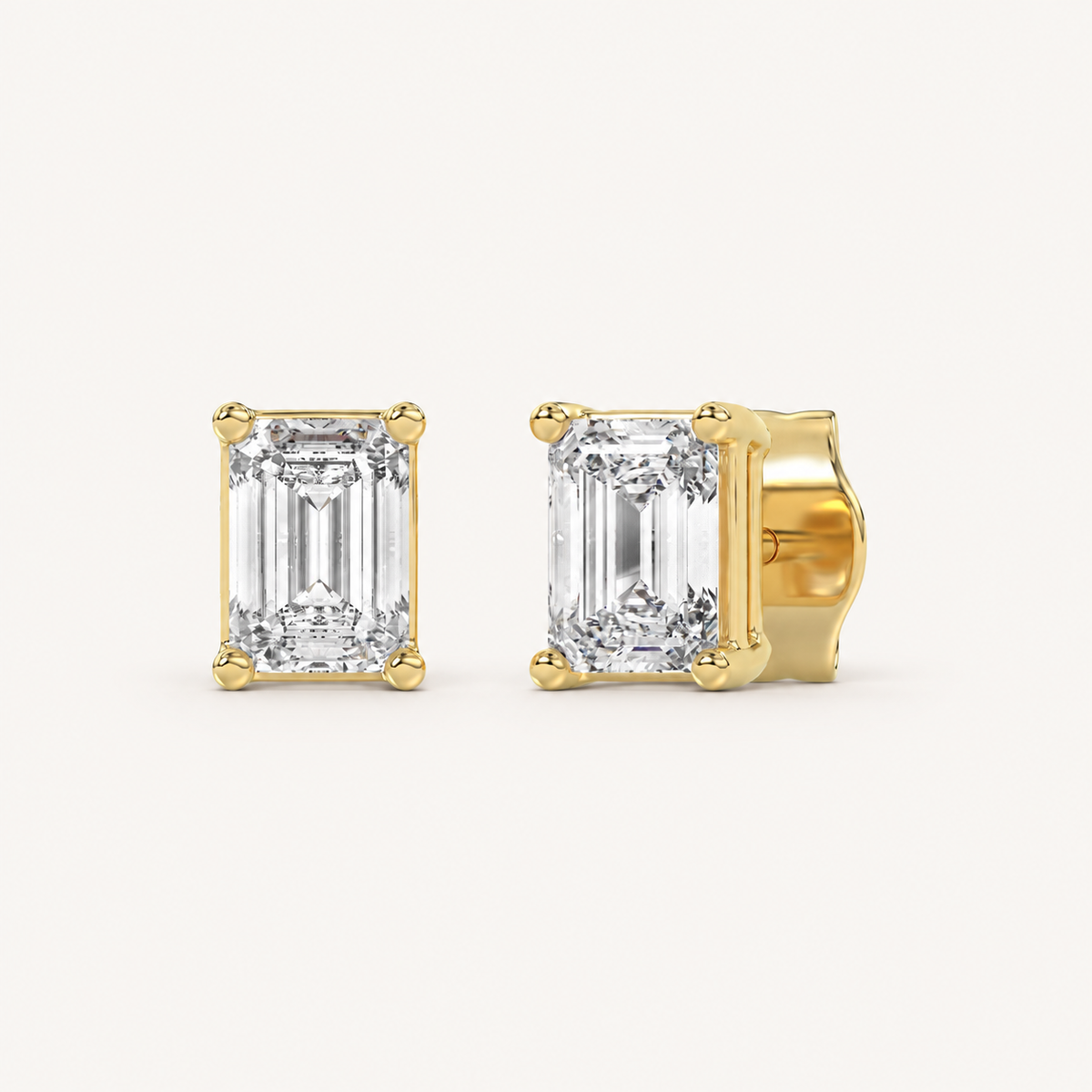 Emerald-cut lab-grown diamond stud earrings in yellow gold, 1 ct total