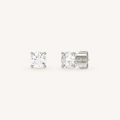 Four-prong martini lab-grown diamond stud earrings in white gold, angled view