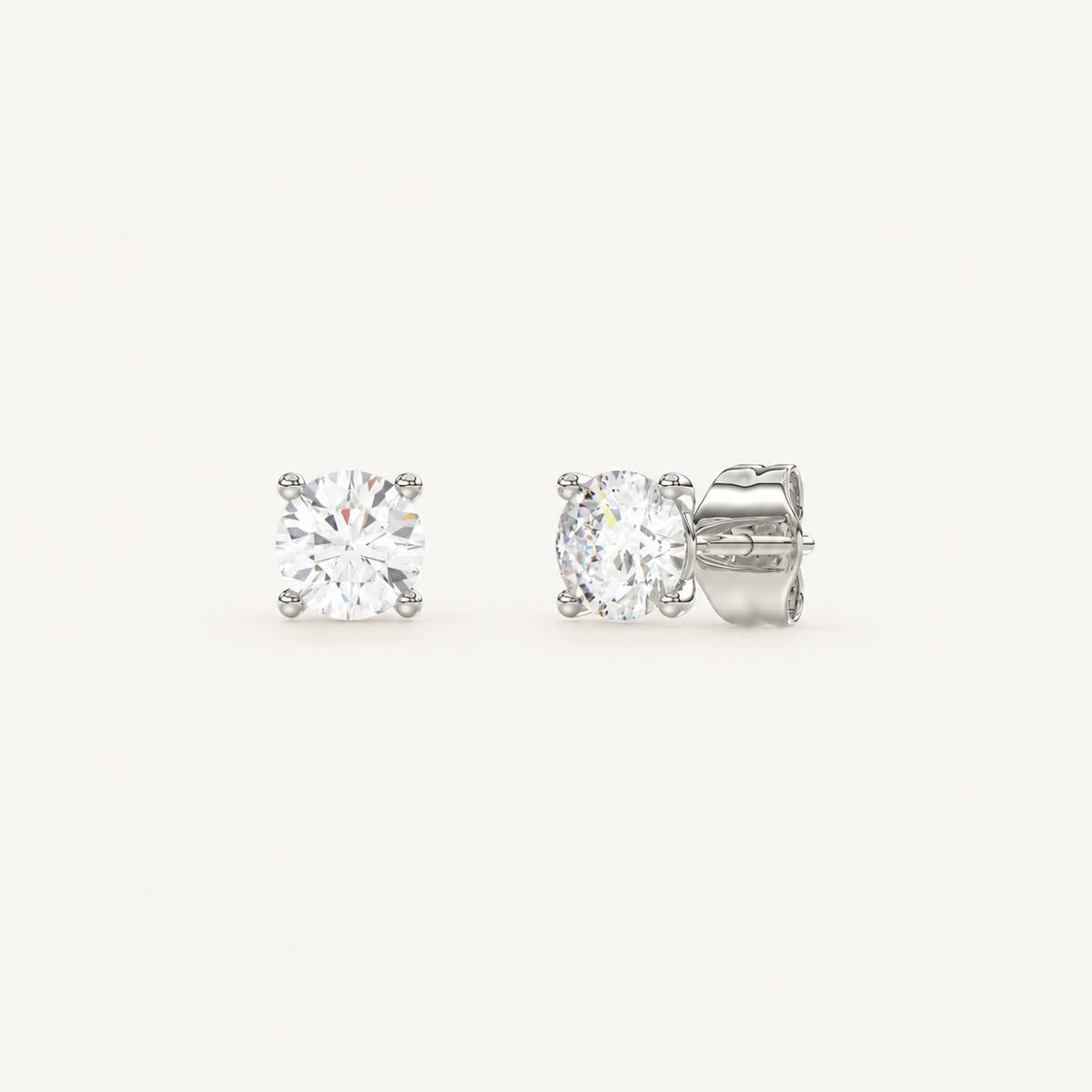 Four-prong martini lab-grown diamond stud earrings in white gold, angled view
