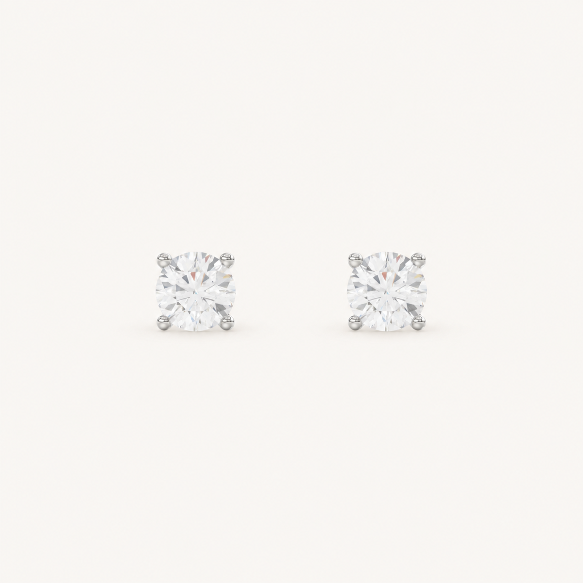Four-prong martini lab-grown diamond stud earrings in white gold, front view