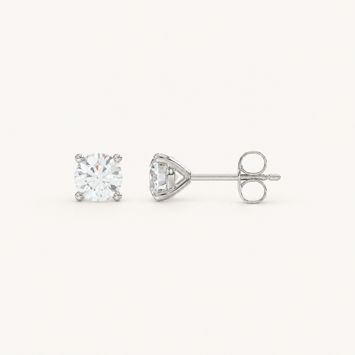 Four-prong martini lab-grown diamond stud earrings in white gold, profile view