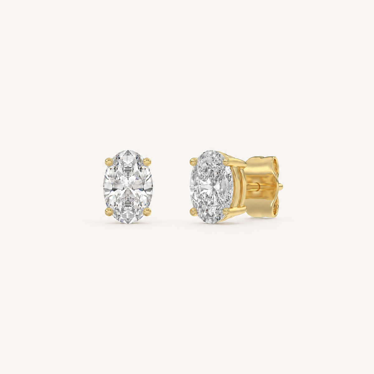 Oval lab-grown diamond stud earrings in yellow gold, 1 ct total