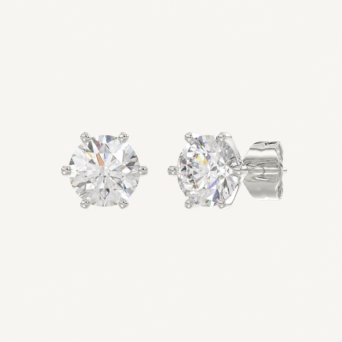 Six-prong round basket lab-grown diamond stud earrings in white gold, angled view