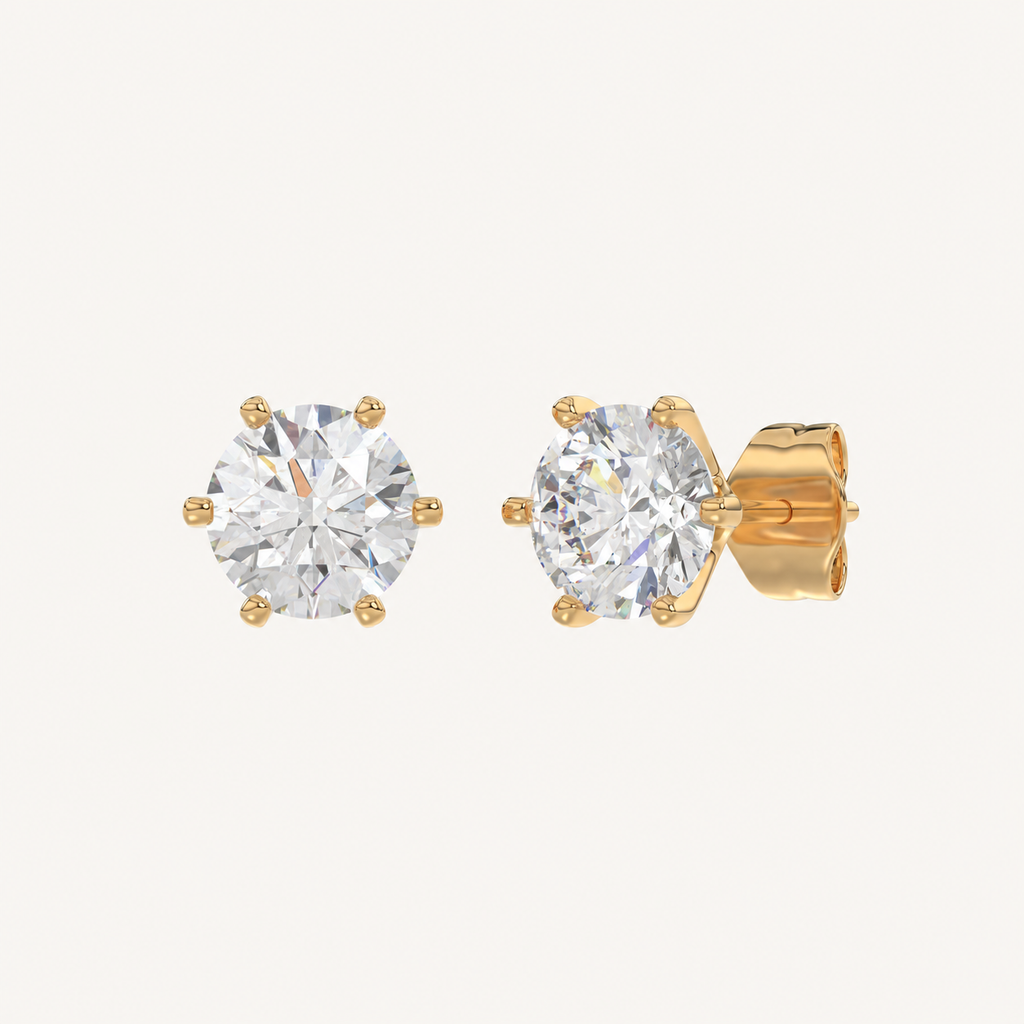 Six-prong round basket lab-grown diamond stud earrings in yellow gold, angled view