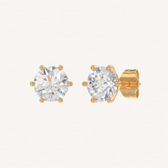 Six-prong round basket lab-grown diamond stud earrings in yellow gold, angled view