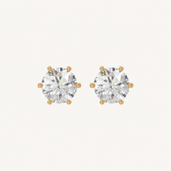 Six-prong round basket lab-grown diamond stud earrings in yellow gold, front pair view