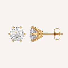 Six-prong round basket lab-grown diamond stud earrings in yellow gold, profile view