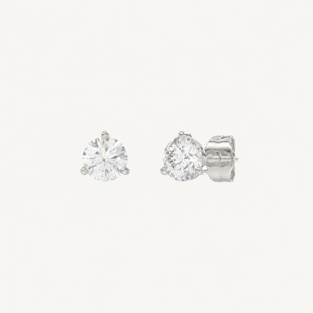 Three-prong martini lab-grown diamond stud earrings in white gold, angled view