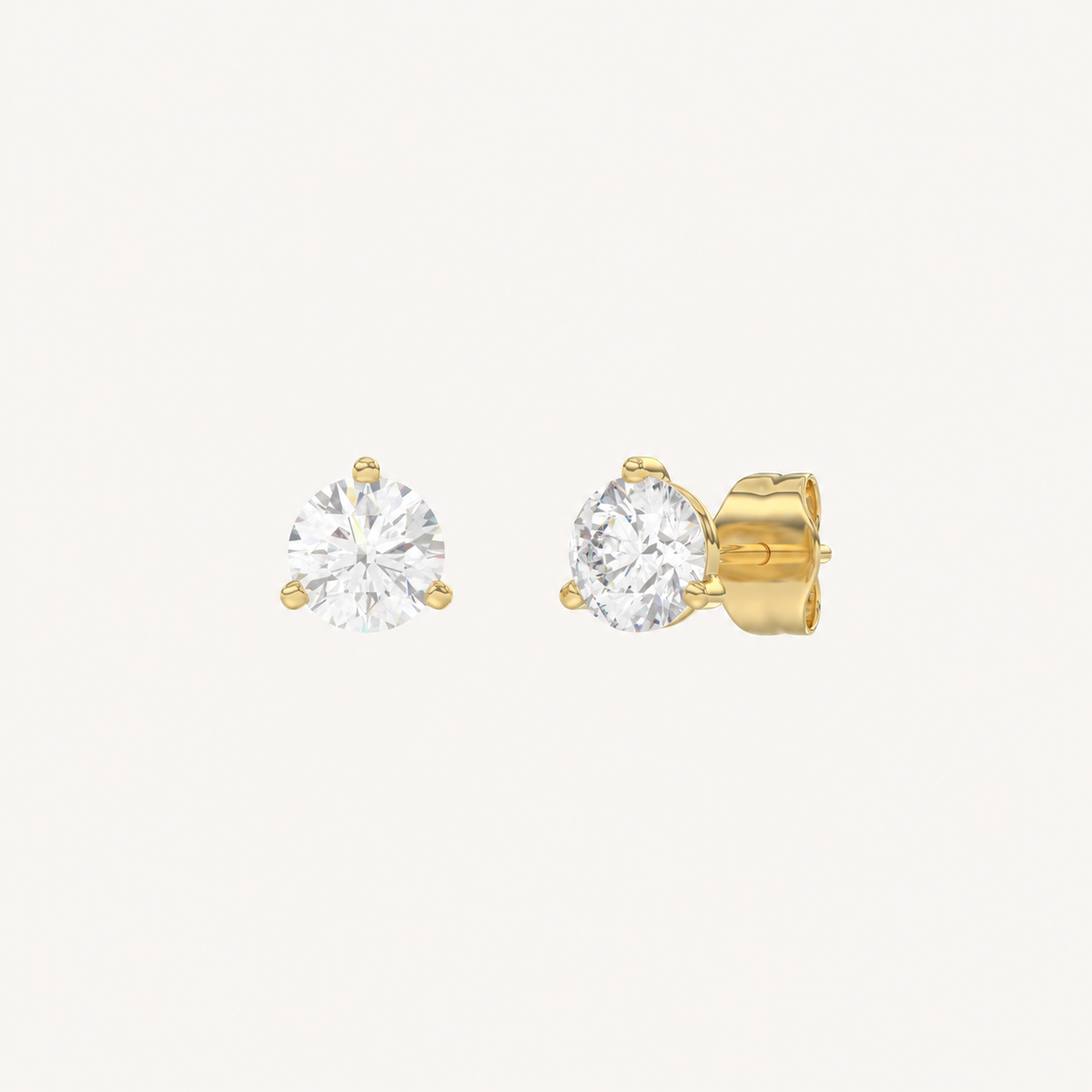 Three-prong martini lab-grown diamond stud earrings in yellow gold, angled view